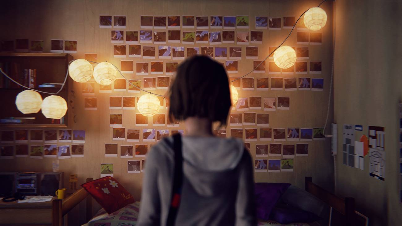 Max Caufield stares at a series of polaroids on a wall in Life Is Strange