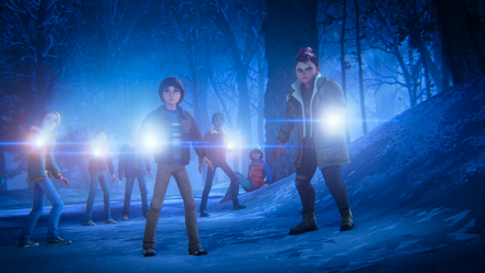 Will and Nikki stand in front of the rest of the party in the snowy forest as everyone points flashlights ahead and looks nervous