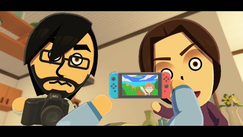 A baby holds a Nintendo Switch in Tomodachi Life: Living the Dream.