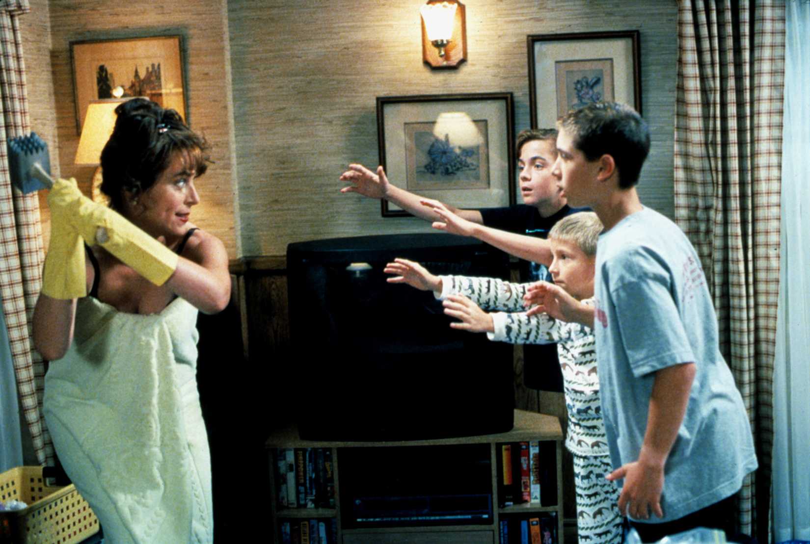 Lois threatens her boys with a meat tenderizer