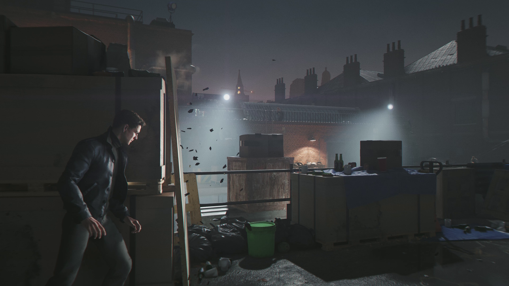 James Bond takes cover on a rooftop