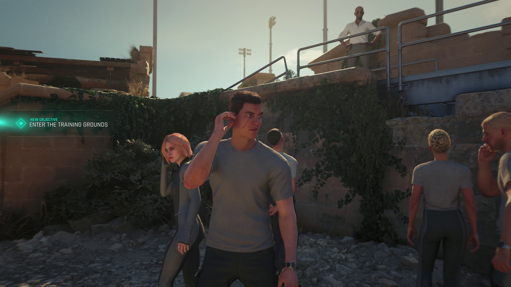 A young James Bond in a T-shirt surrounded by other recruits. A mission marker says "enter the training grounds"
