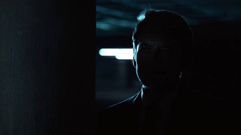 Deep Throat speaks from the shadows of a parking garage