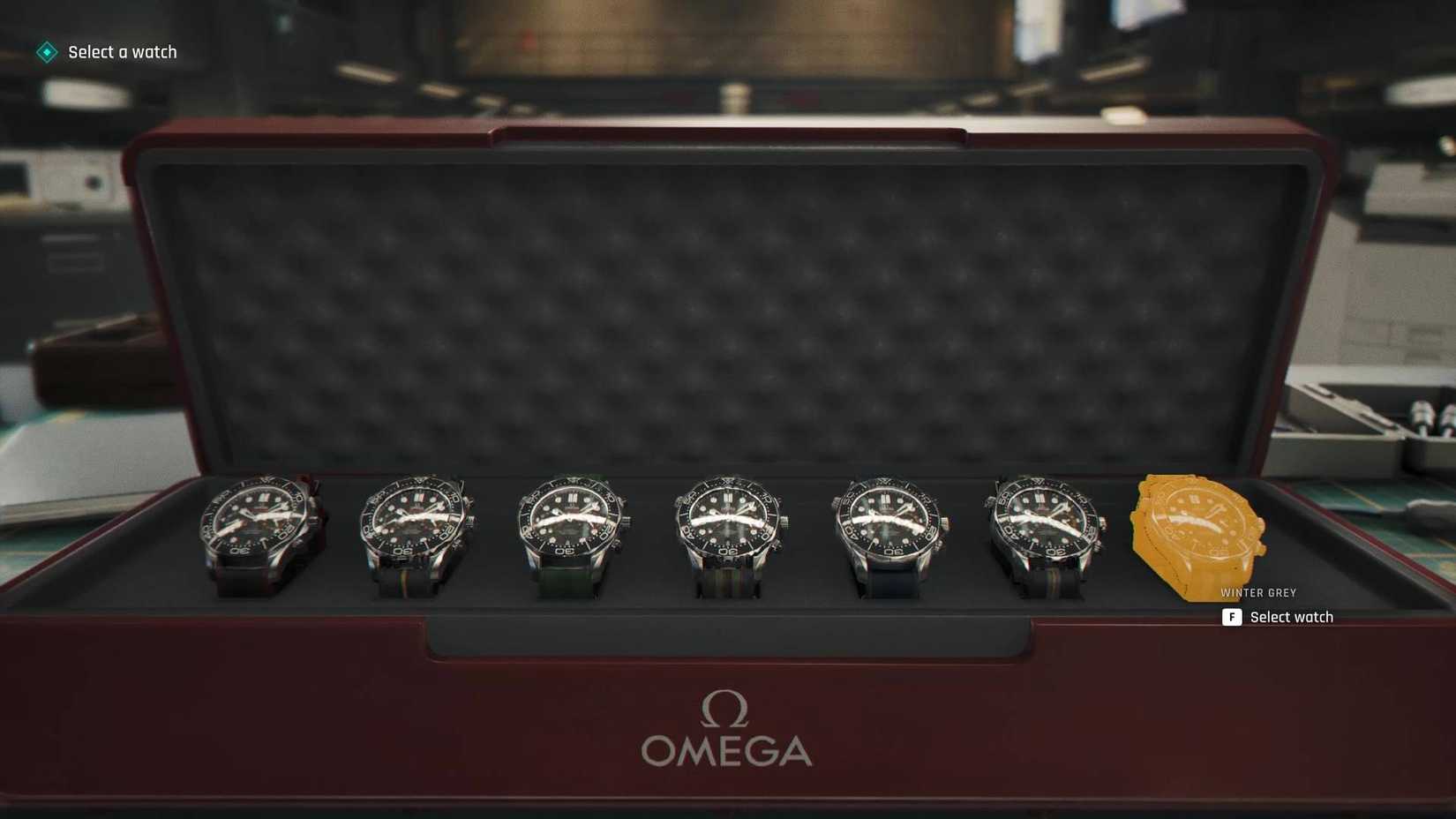 The seven Omega Q-Watches in the box in 007 First Light.