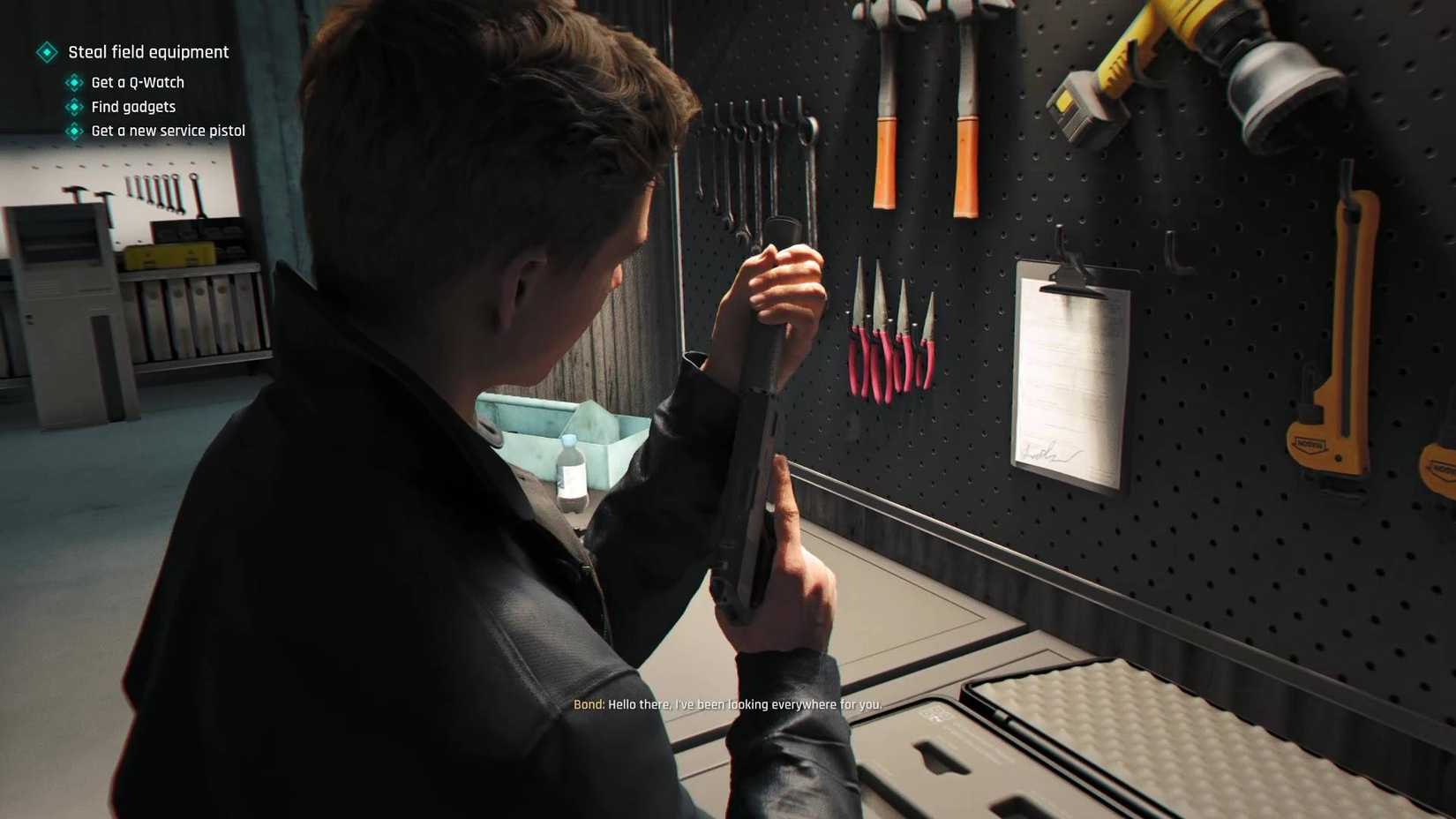 Bond equipping a suppressor to his service pistol.