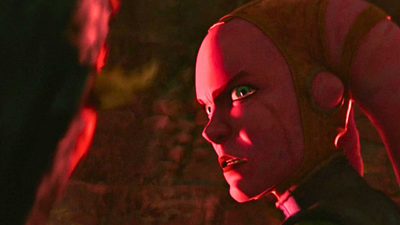 Screenshot of Devon Izara from Star Wars: Maul — Shadow Lord season 1. A pink Twi'lek, she is based in a red light, and looks angry and vengeful. 