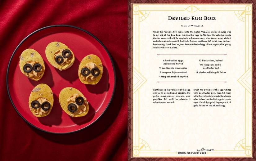 A red plate topped with five gold colored deviled eggs with black olive slices resembling eyes from the Hazbin Hotel Bar Book