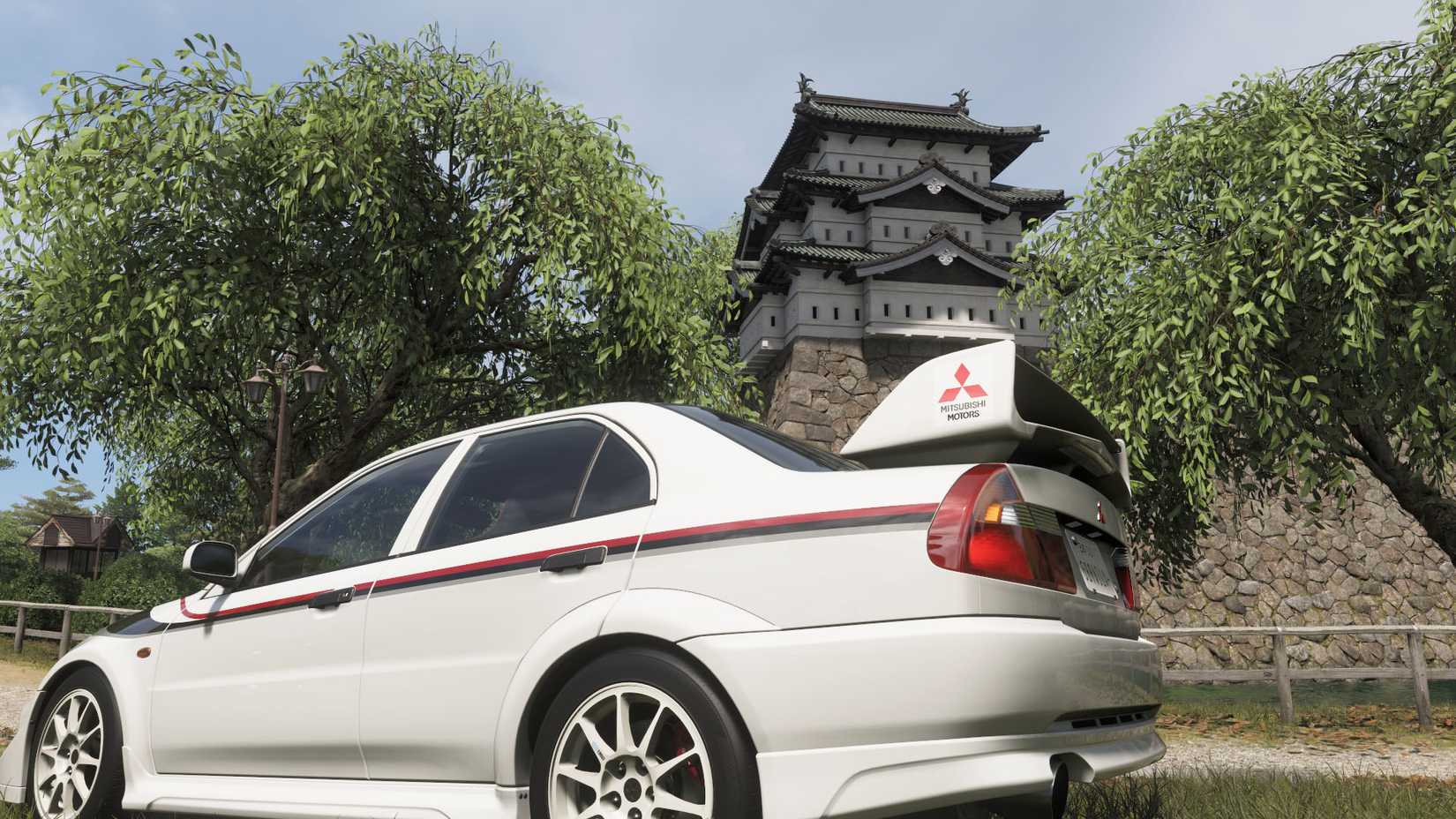 A Forza Horizon 6 screenshot featuring a Lancer parked in front of a majestic Japanese castle