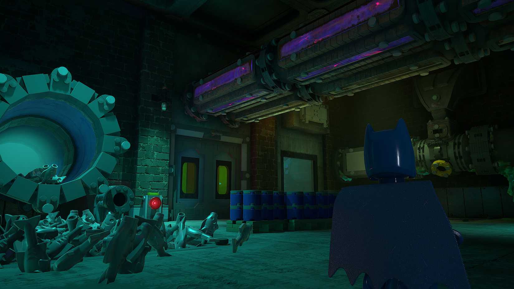  Legacy of the Dark Knight screenshot showing Batman standing in front the door that leads to the corridor where you can find the red brick in the "Red Hood Gang" mission