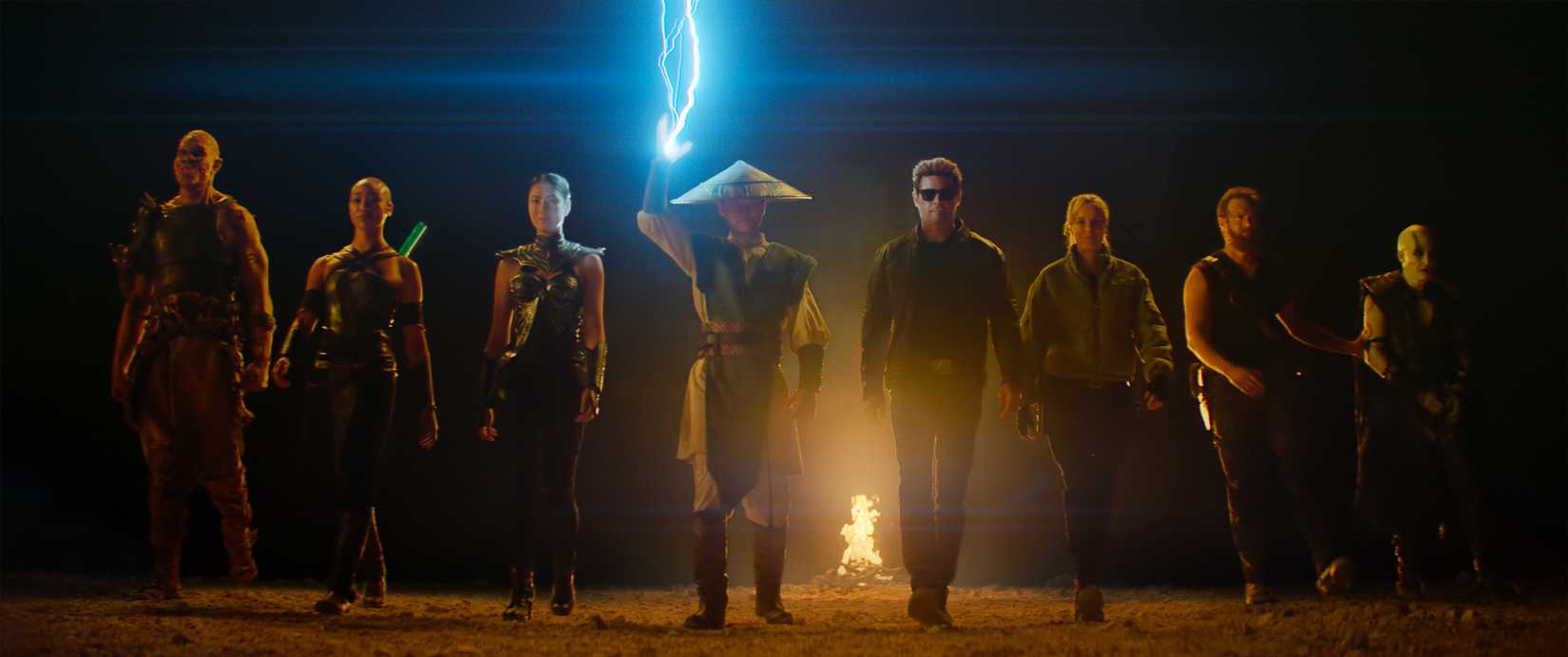 A still from Mortal Kombat 2's ending featuring Baraka, Jade, Kitana, Raiden, Johnny Cage, Sonya, Kano and Quan Chi