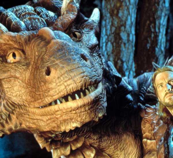 Draco the Dragon and Dennis Quaid as Bowen stare out into the distance.