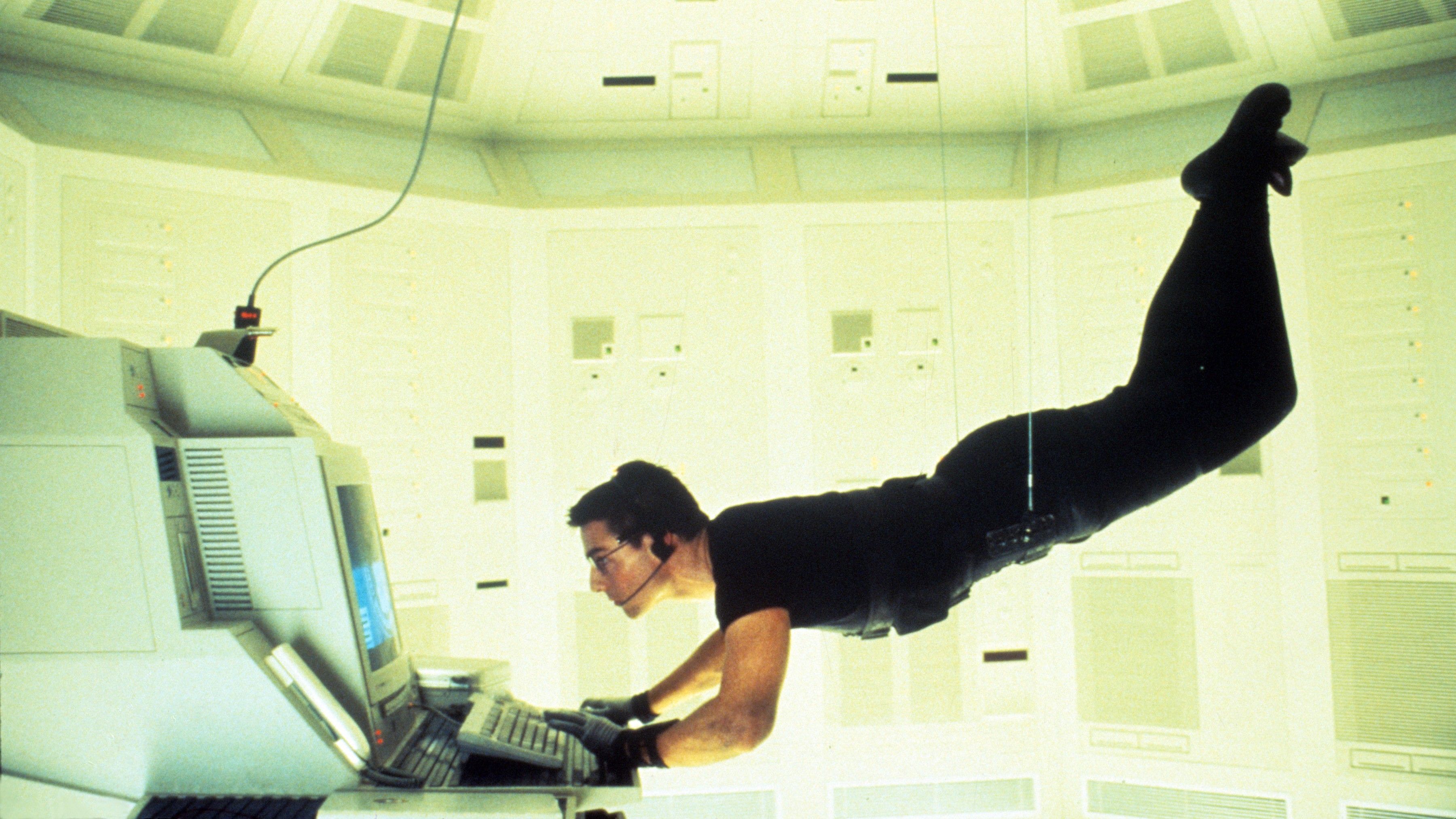 Tom Cruise suspended during the iconic vault sequence