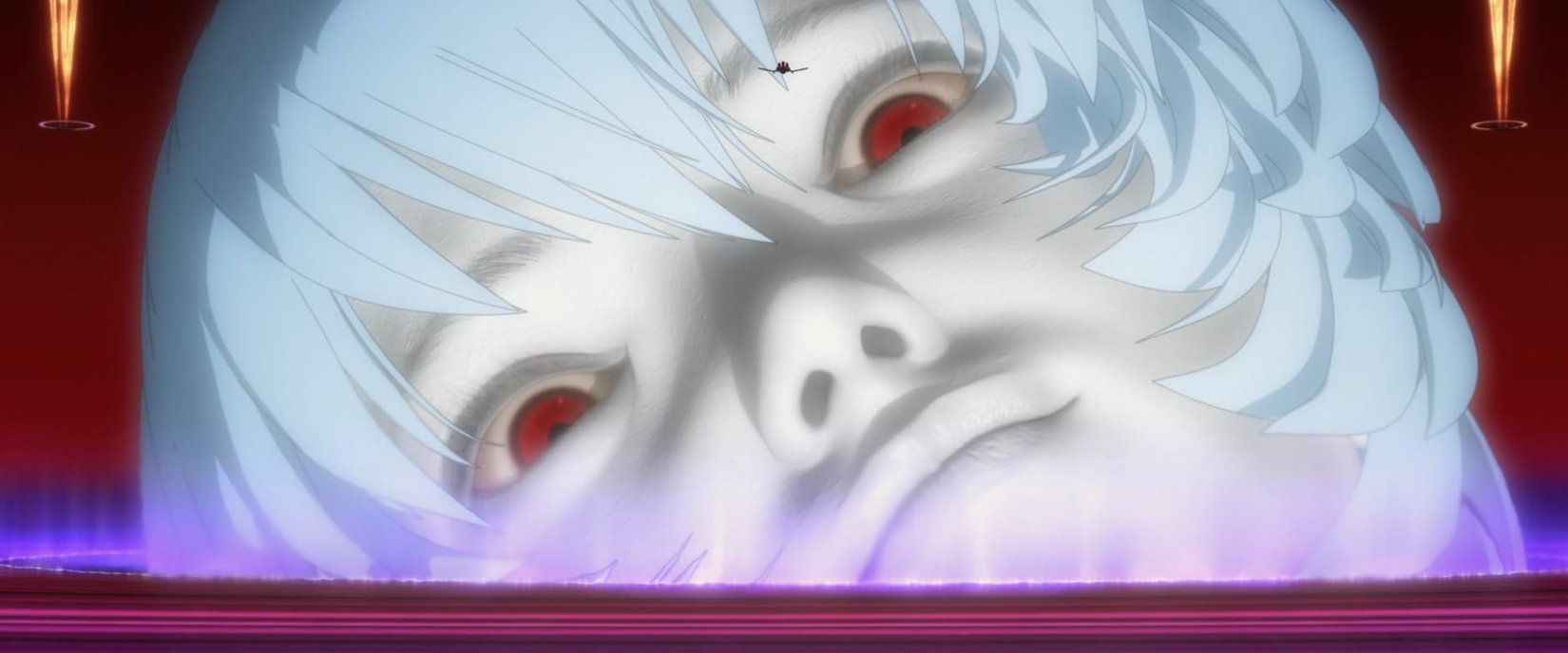A massive head emerges out of a red backdrop in Evangelion: 3.0 + 1.0 Thrice Upon a Time (2021)