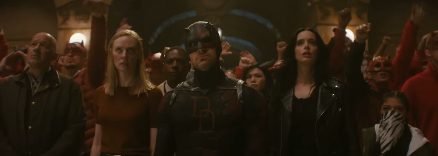 Daredevil standing among protesters
