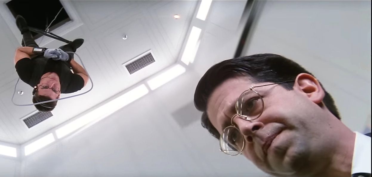 Ethan Hunt hangs over William Donloe in the vault