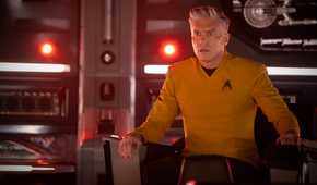 Captain Pike (Anson Mount) sits in the captain's chair on the Enterprise looking worried in Star Trek: Strange New Worlds season 4.