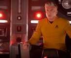 Captain Pike (Anson Mount) sits in the captain's chair on the Enterprise looking worried in Star Trek: Strange New Worlds season 4.