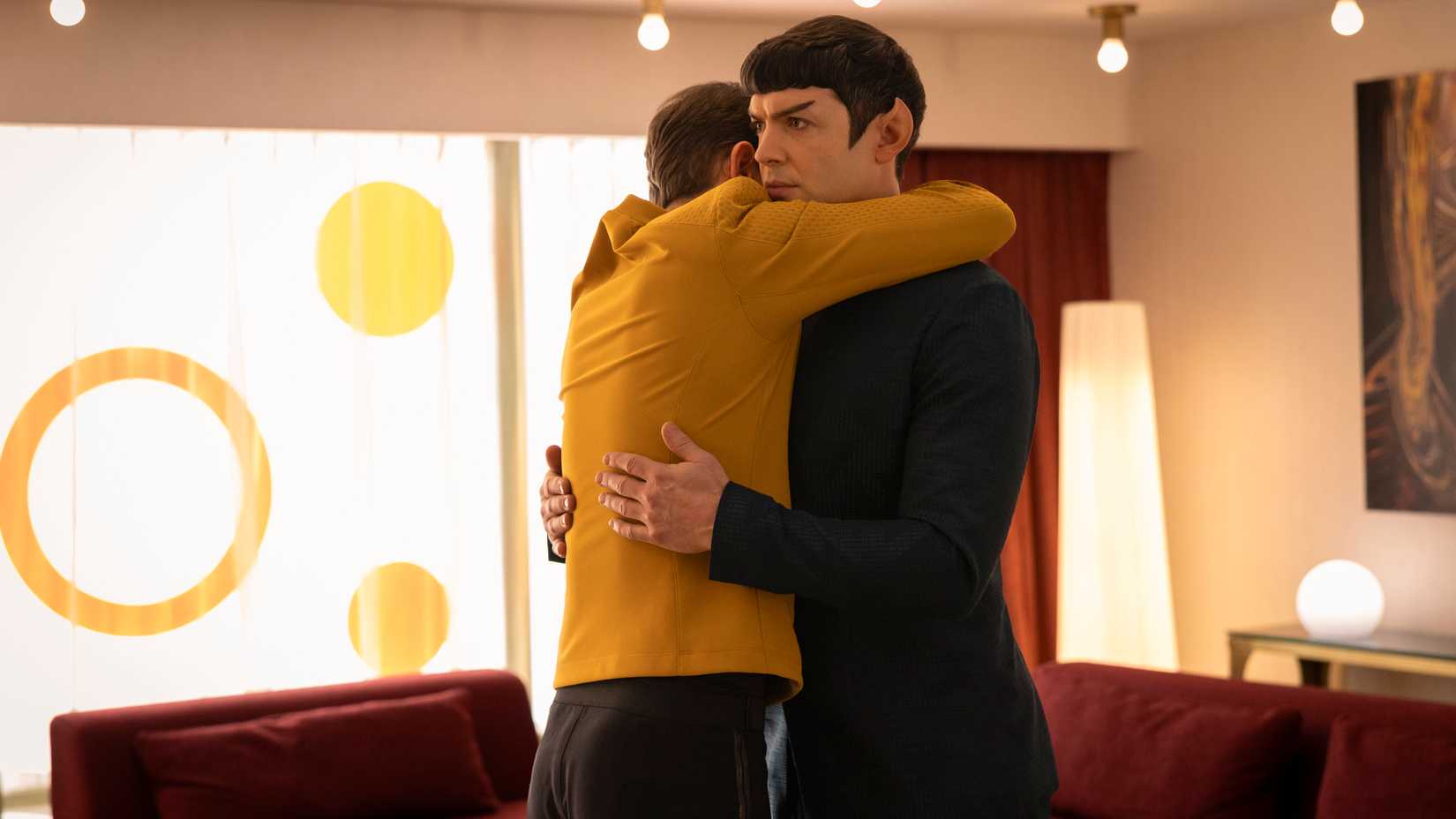 Spock (Ethan Peck) looks very awkward while hugging James T. Kirk (Paul Wesley) in Star Trek: Strange New Worlds season 4.
