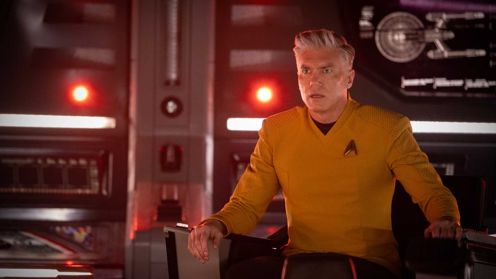 Pike sitting in his command chair in a still from Star Trek: Strange New Worlds season 4