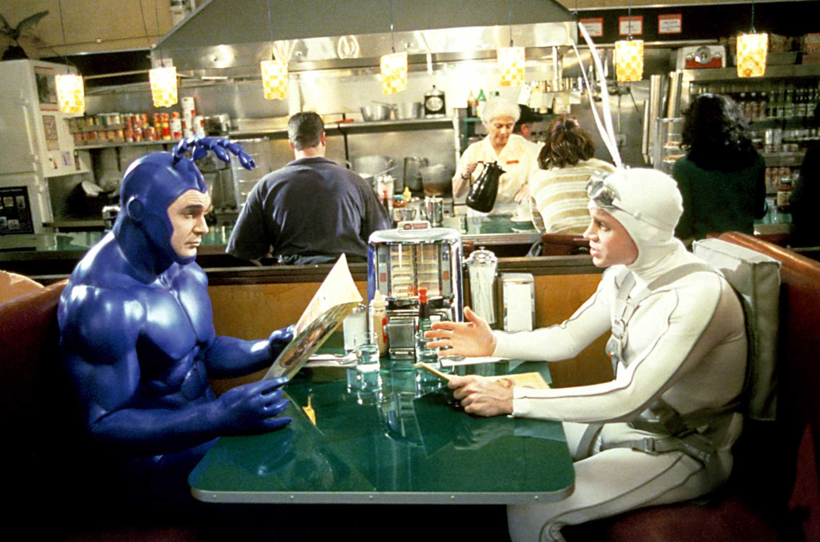 The Tick and Arthur have coffee