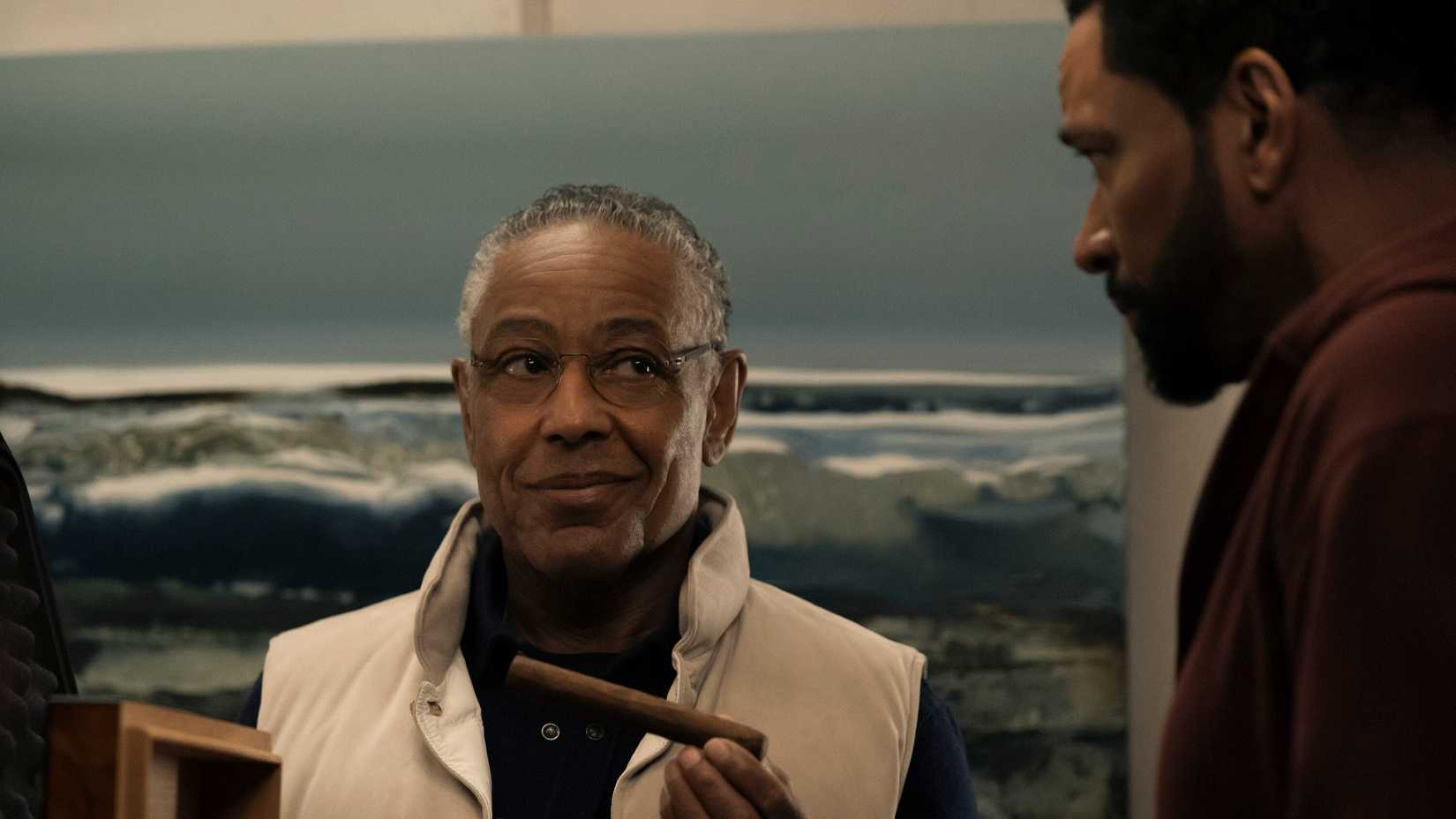 Stan Edgar (Giancarlo Esposito) smiles and offers a cigar to Mother's Milk (Laz Alonso) on The Boys.