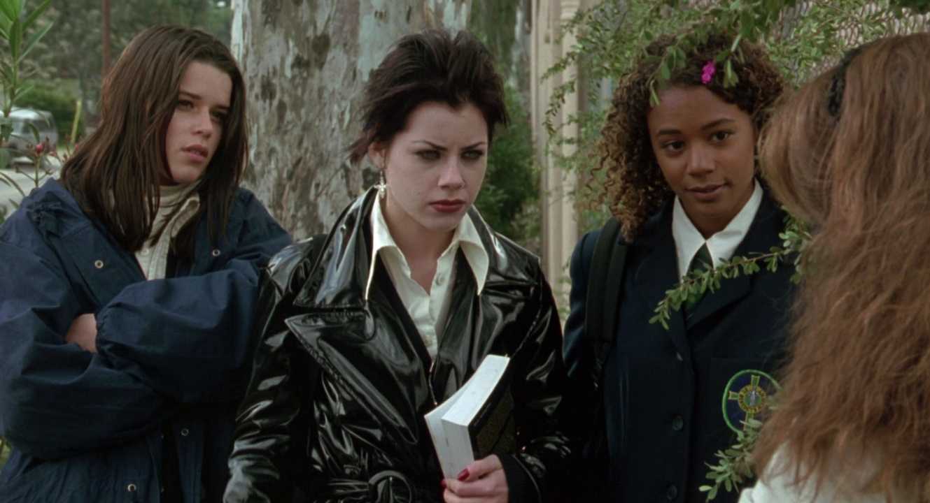 Three teen girls glare at their former friend in The Craft 1996