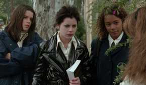 Three teen girls glare at their former friend in The Craft 1996