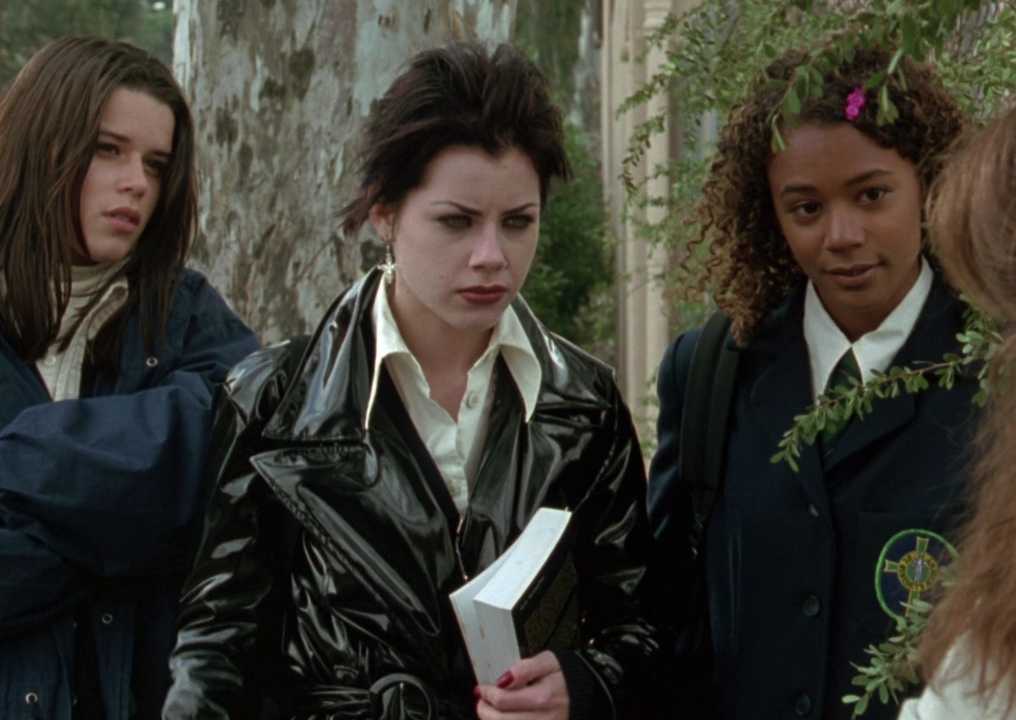 Three teen girls glare at their former friend in The Craft 1996