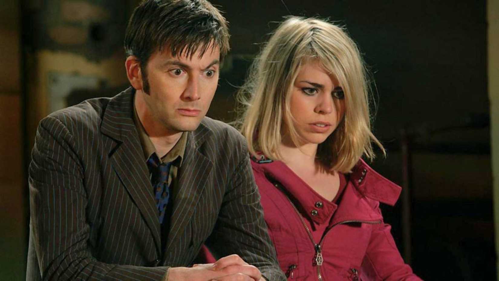 An image of The Doctor and Rose in The Impossible Planet. Both are looking down at something and look mildly disturbed by what they see.