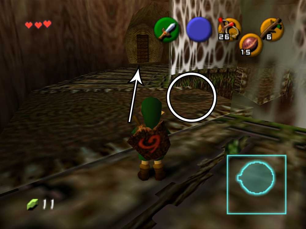 Link em um corredor ao lado de uma grande parede de teias em Ocarina of Time.