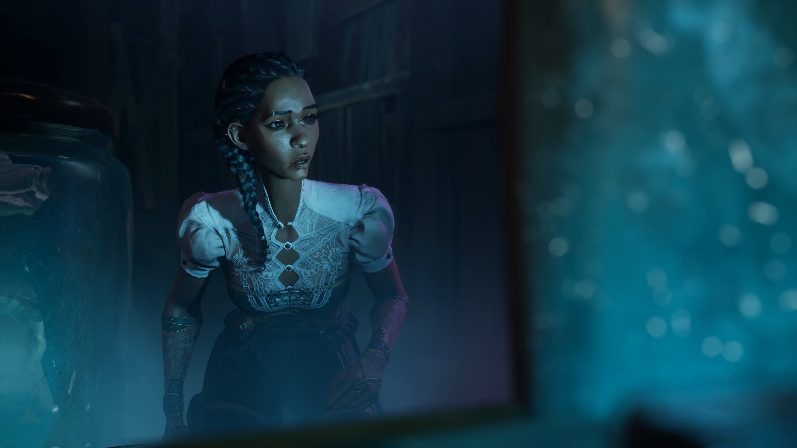 A young woman looks lost and confused reflected in a mirror in blue lighting