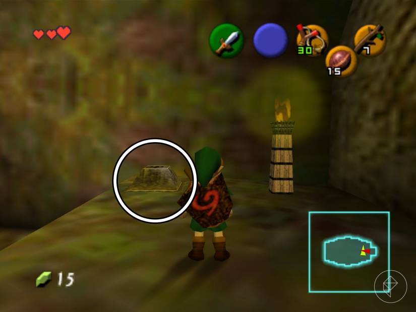 Link standing in front of a button platform and a lit torch in Ocarina of Time