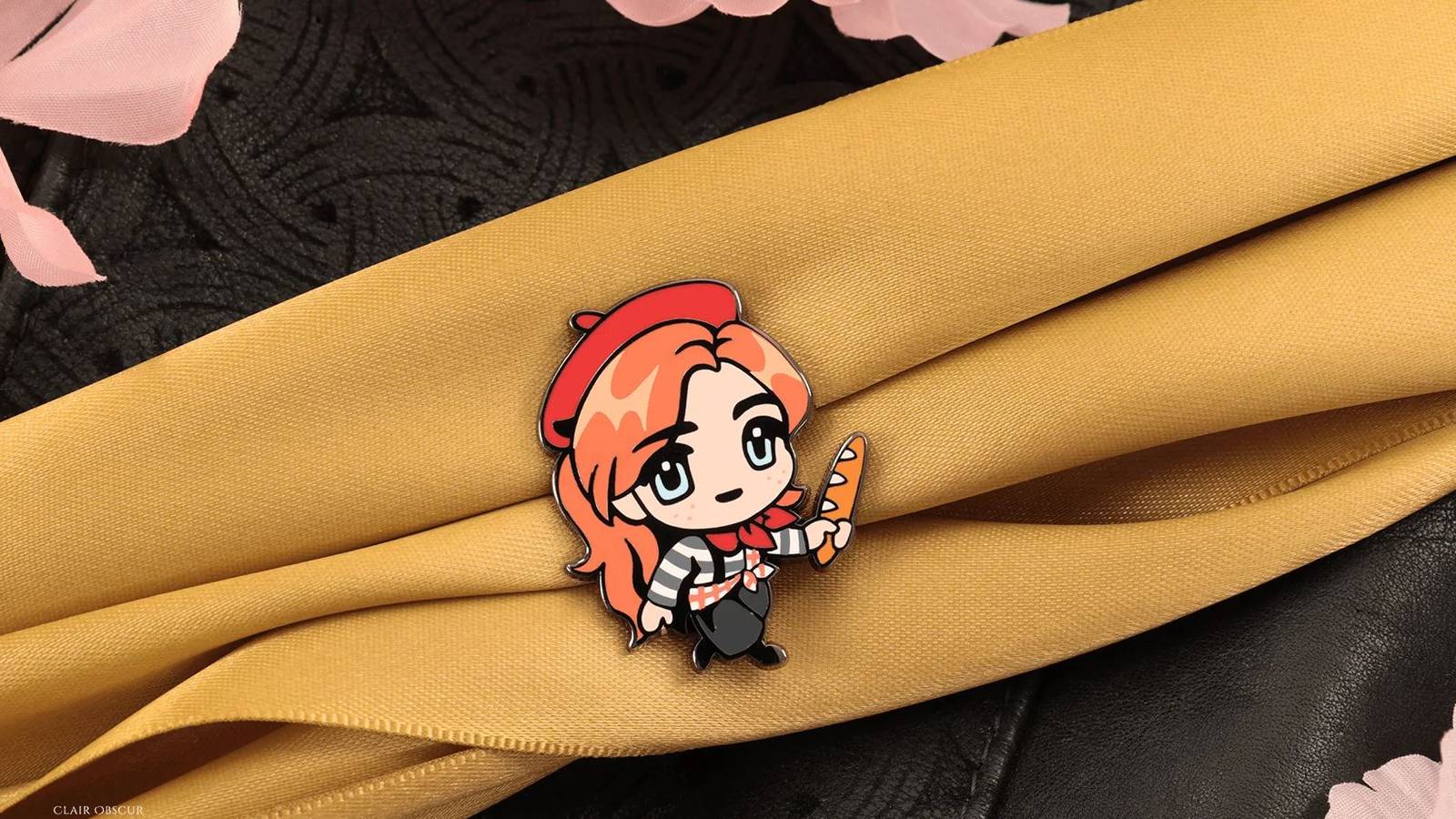 A pin of Maelle from Expedition 33, where she's holding a baguette while dressed in the game's alternate French costume. 
