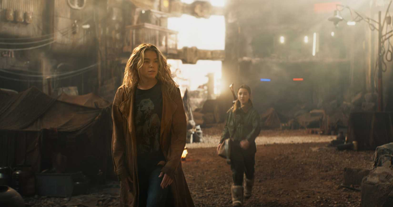 Supergirl (Milly Alcock) and her teenage tagalong Ruthye (Eve Ridley) in a run-down, rusty space town in Supergirl