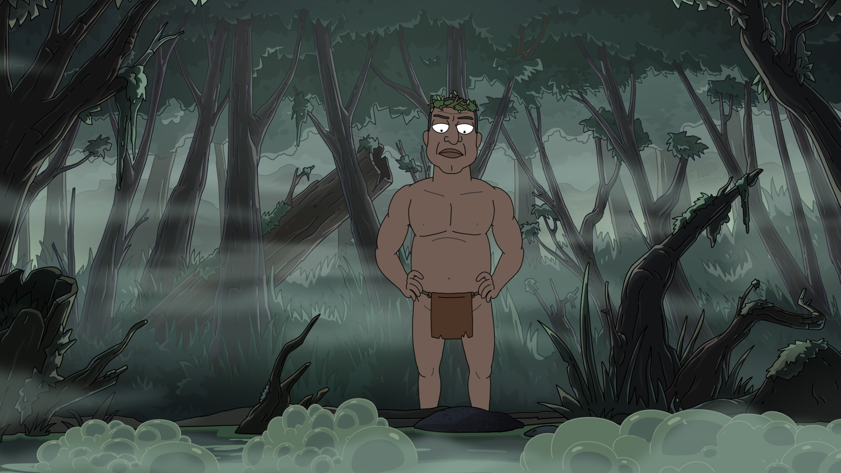 President Curtis wearing a leaf crown and a loincloth stands in a swamp