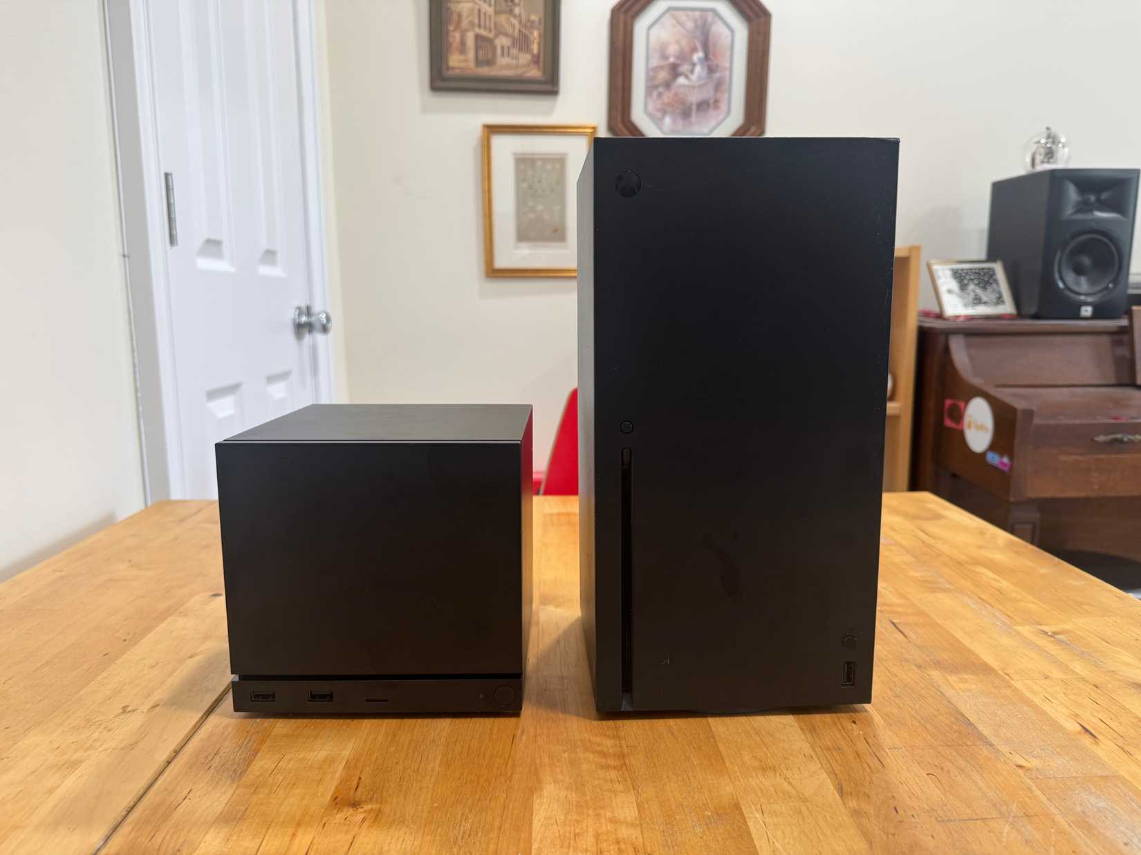 A Steam Machine sits next to an Xbox Series X.