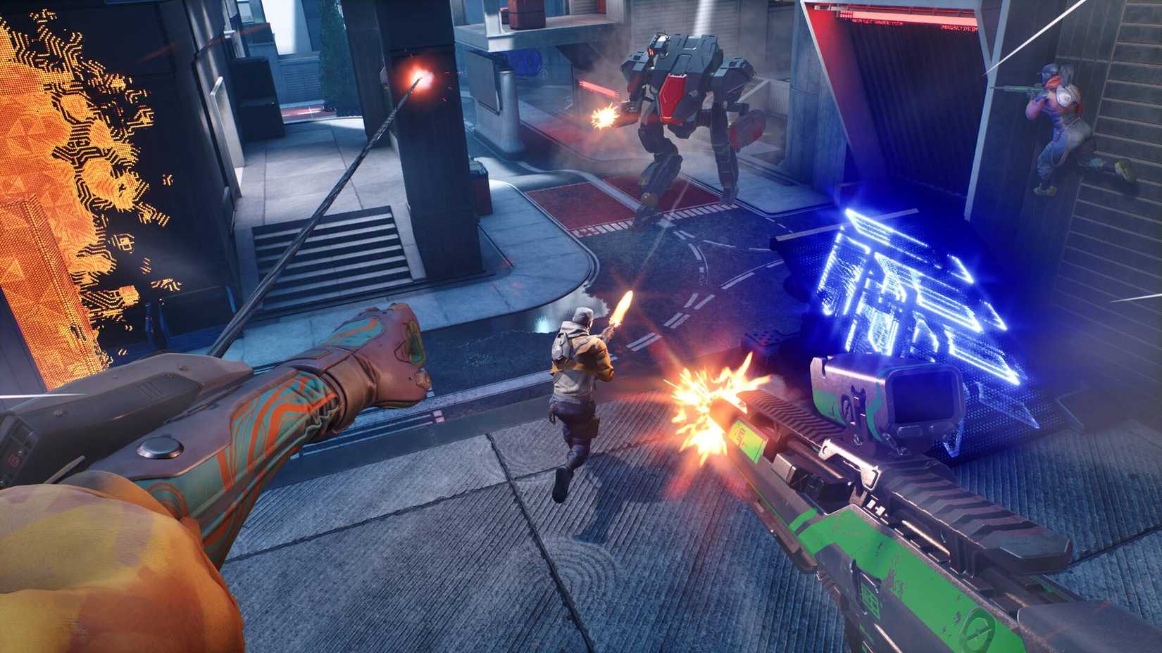 The player grappling to a wall in Empulse while two teammates shoot at a mech.