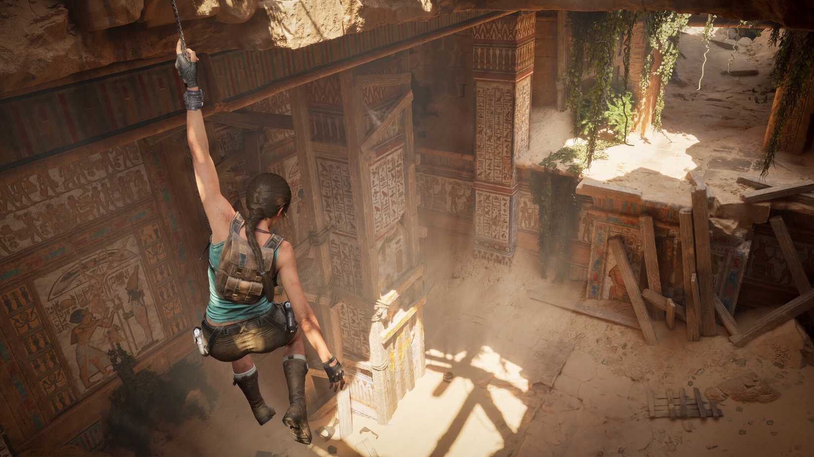 Lara Croft hangs from a beam in Tomb Raider: Legacy of Atlantis.