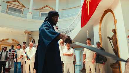 Mahershala Ali points a sword at a man in Your Mother Your Mother Your Mother