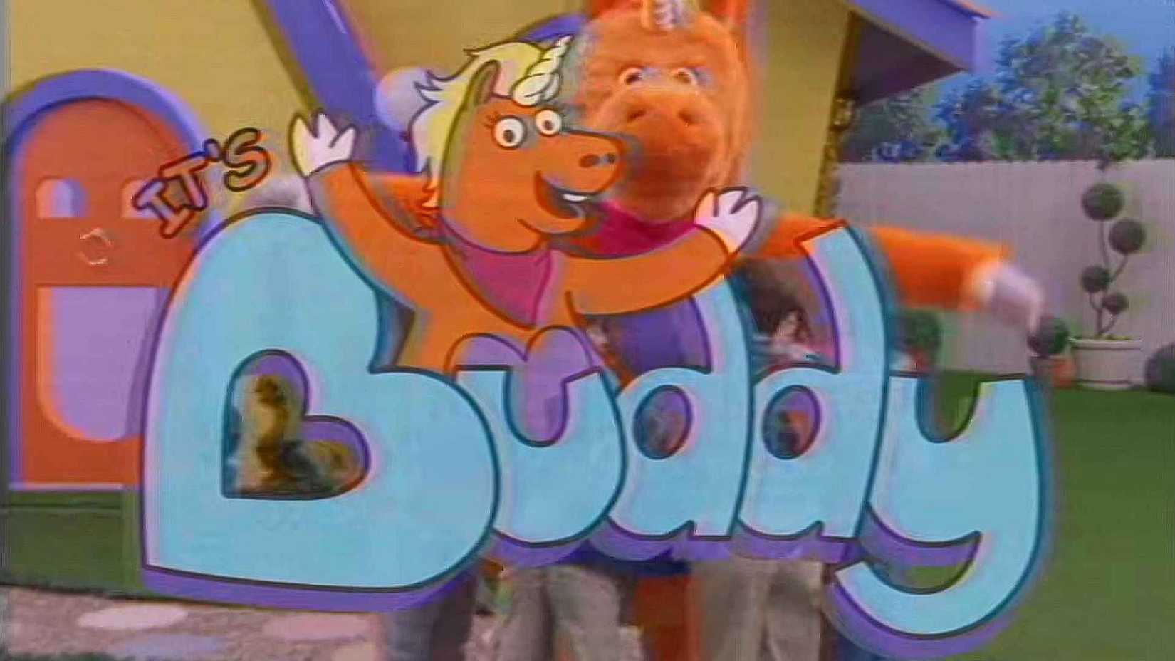 A kids show mascot unicorn named Buddy hugs children, text that reads "It's Buddy" is in front of the group