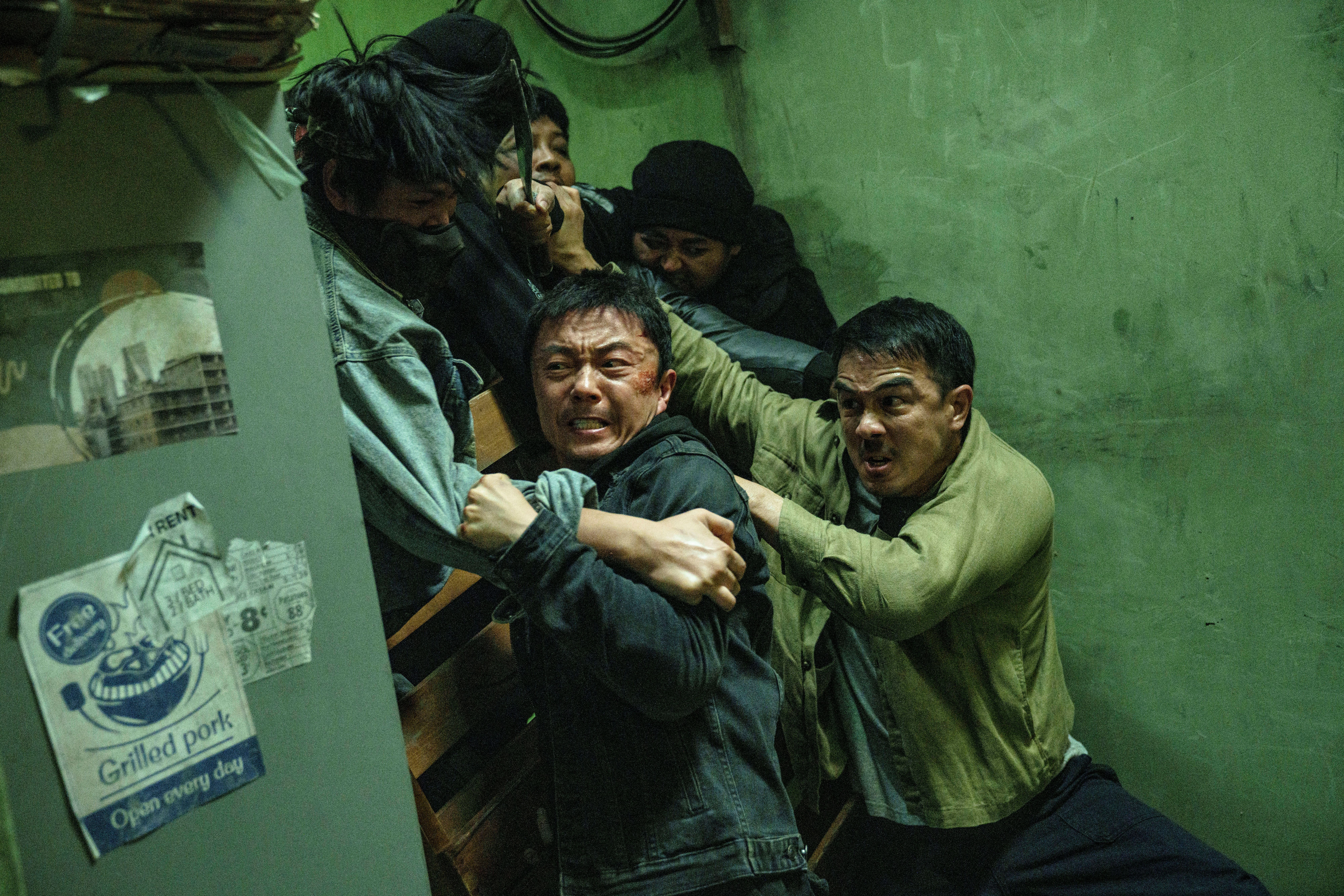 Joe Taslim and Xie Miao push back a crowd of bad guys in The Furious