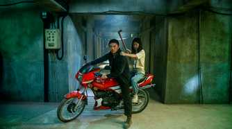 Xie Miao and his daughter on a bike in The Furious