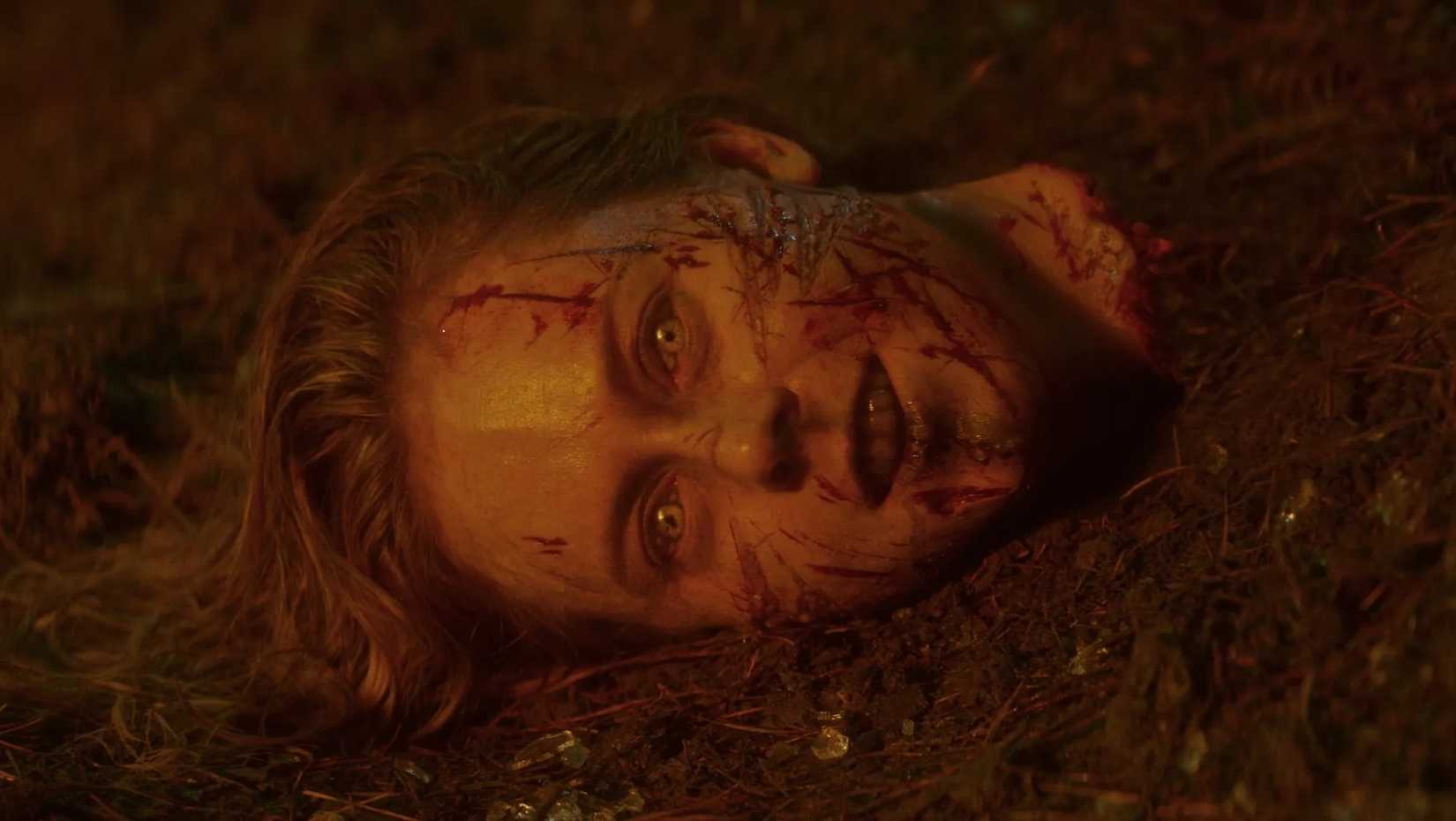 A head with its eyes and mouth open in Evil Dead Burn