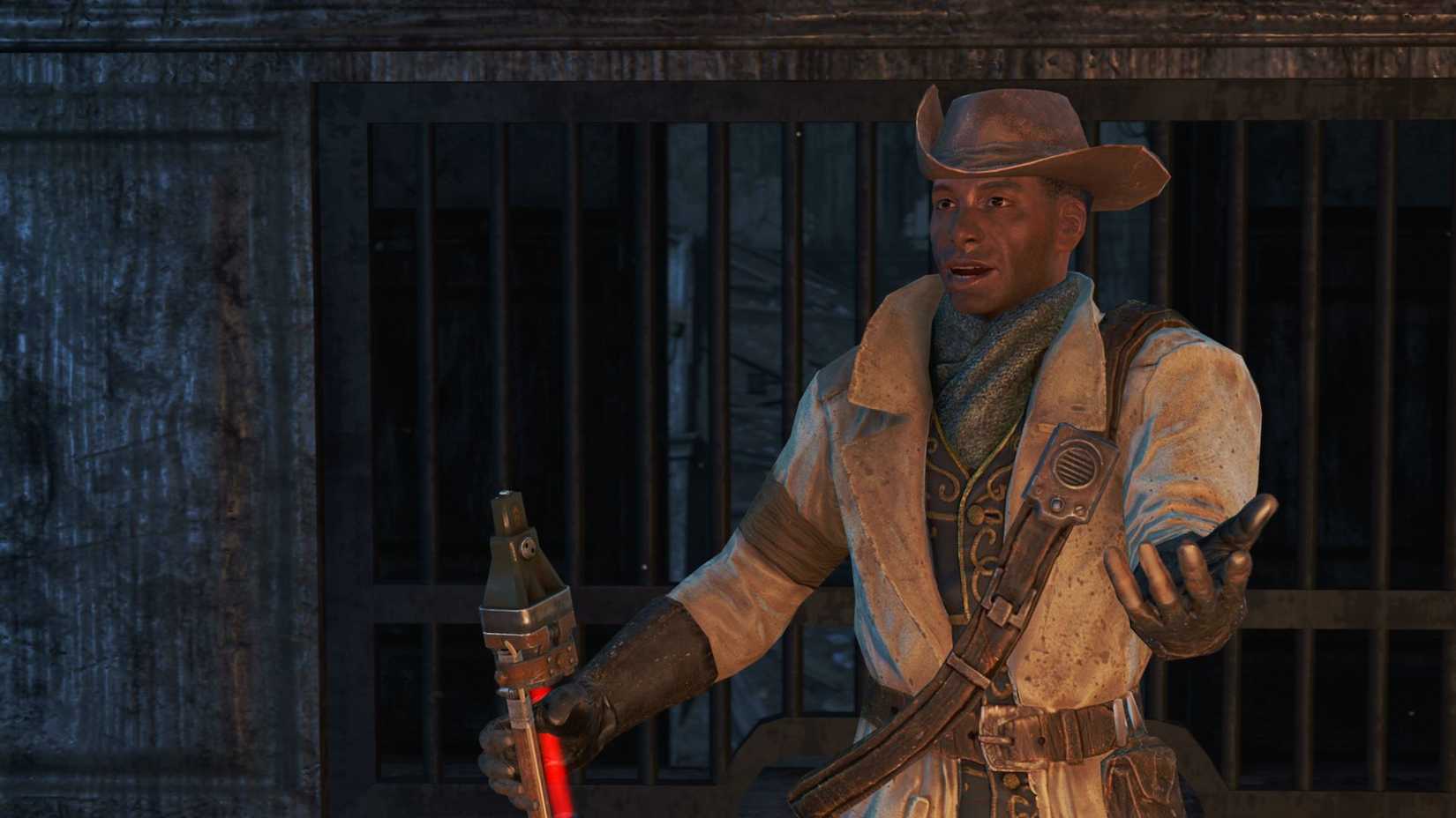 Preston Garvey, leader of the Minutemen faction, gestures while holding his rifle
