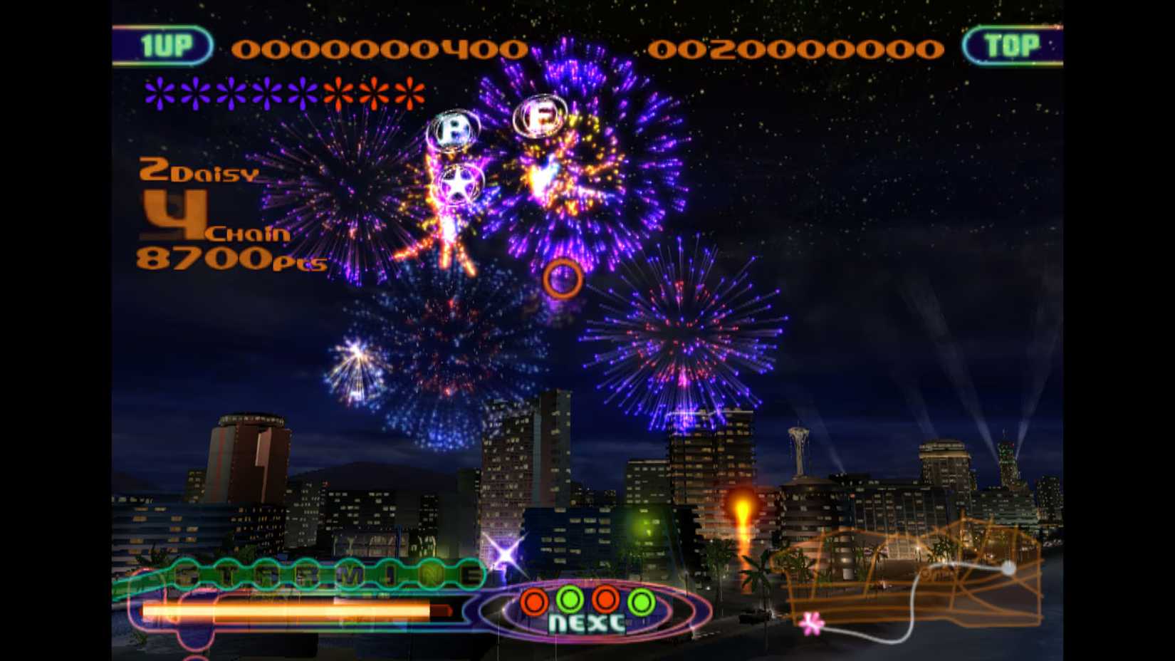 Fireworks explode over a city in FantaVision.