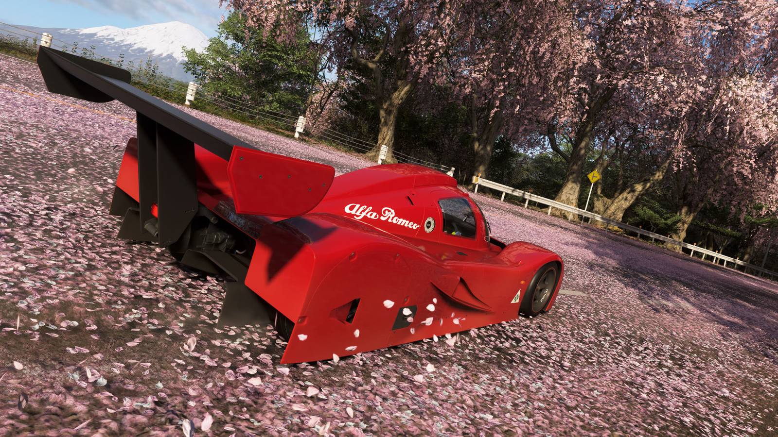 A Forza Horizon 6 screenshot showing an Alfa Romeo car near toem sakura trees