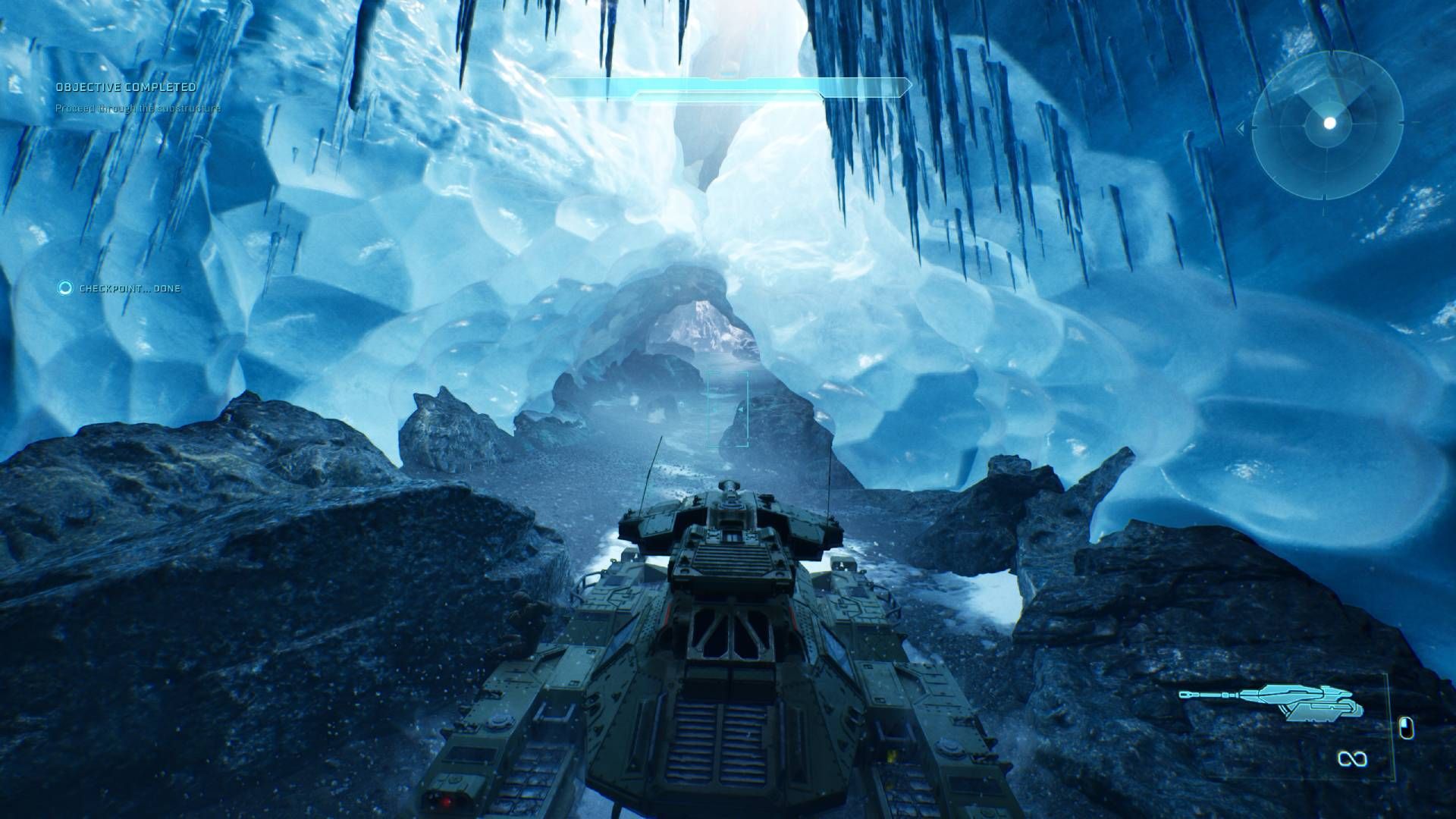 The player in Halo Campaign Evolved driving a scorpion tank up an icy slope.