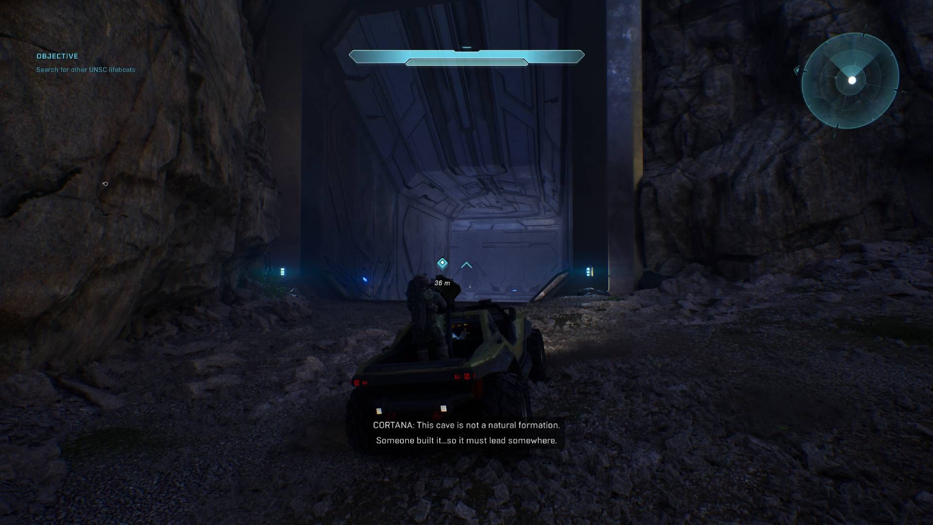 Master Chief driving the warthog into the unnatural cave formation in Halo in Halo Campaign Evolved