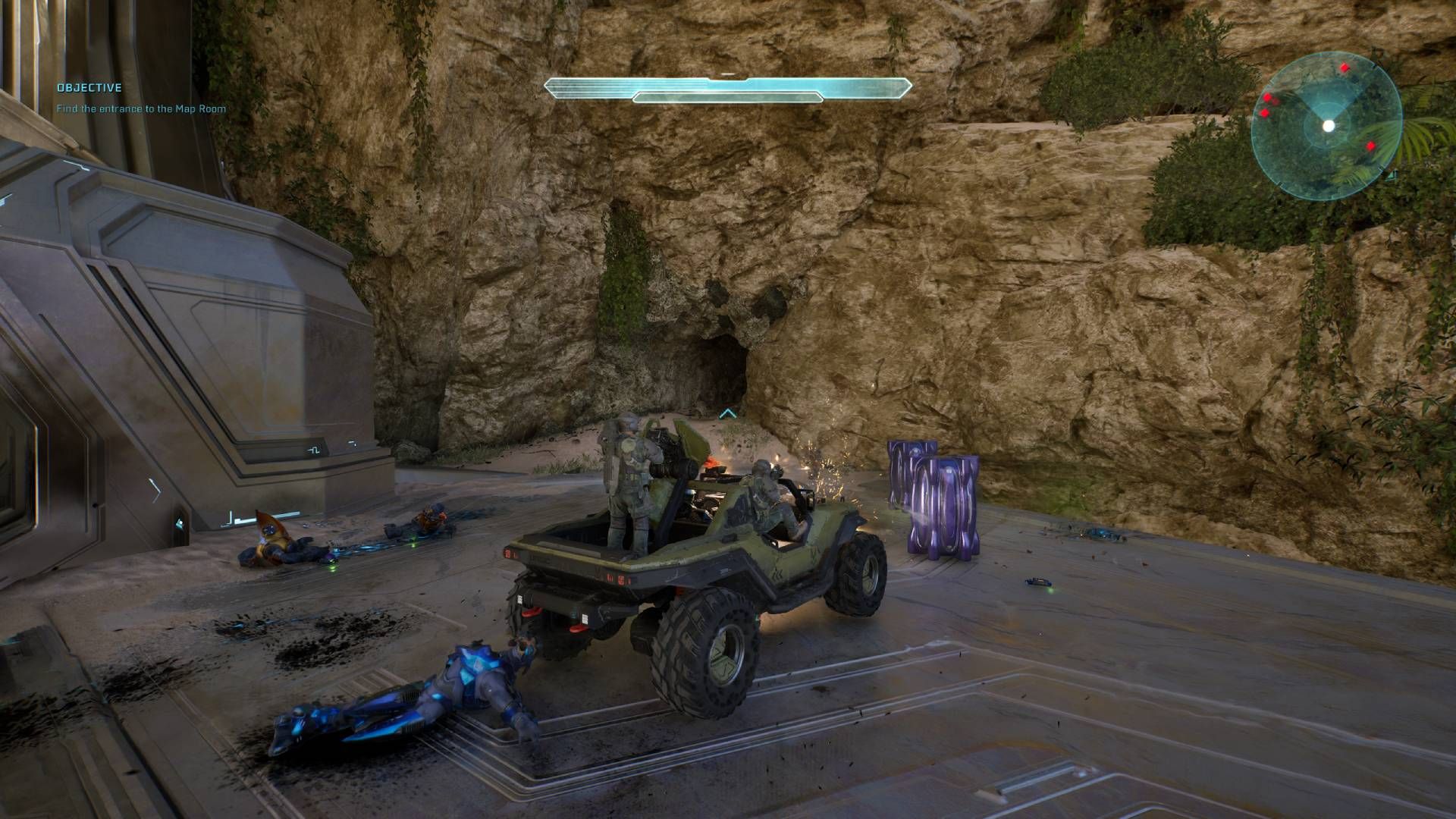 The player in Halo: Campaign Evolved driving a warthog next to the cave with the skull in.