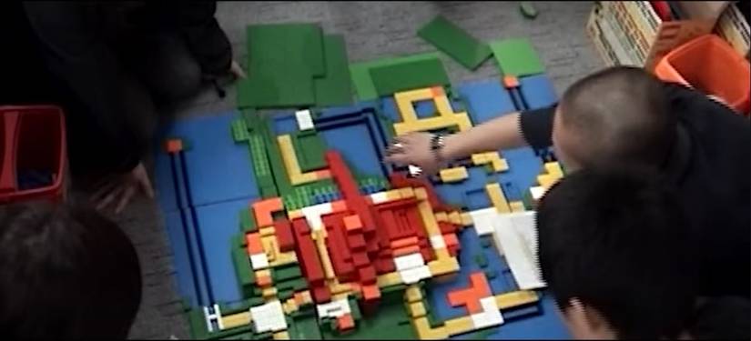 Pokemon developers Game Freak are shown crafting the Sinnoh map for Diamond and Pearl, using Lego bricks.